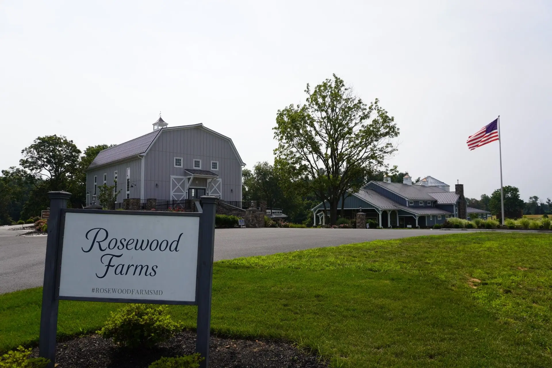 Rosewood Farms post frame barn and event venue with silo, set on open farmland